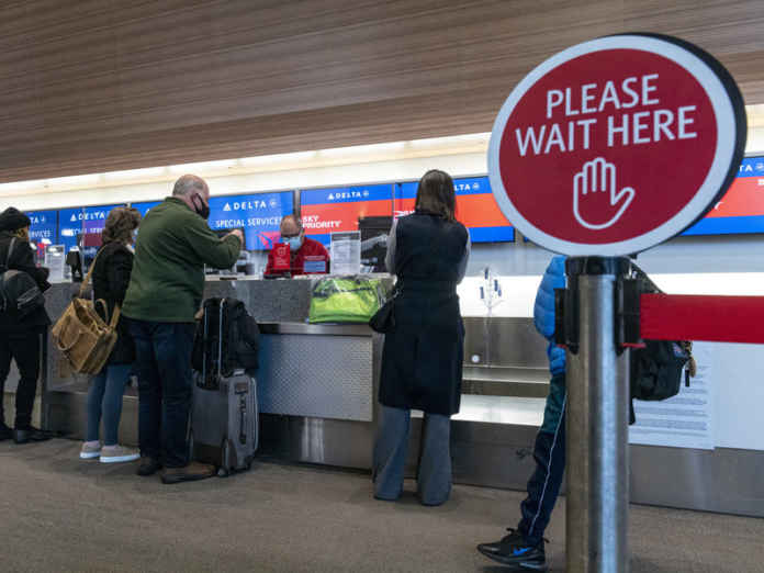 Travelers At SFO Airport Ahead Of Christmas Holiday